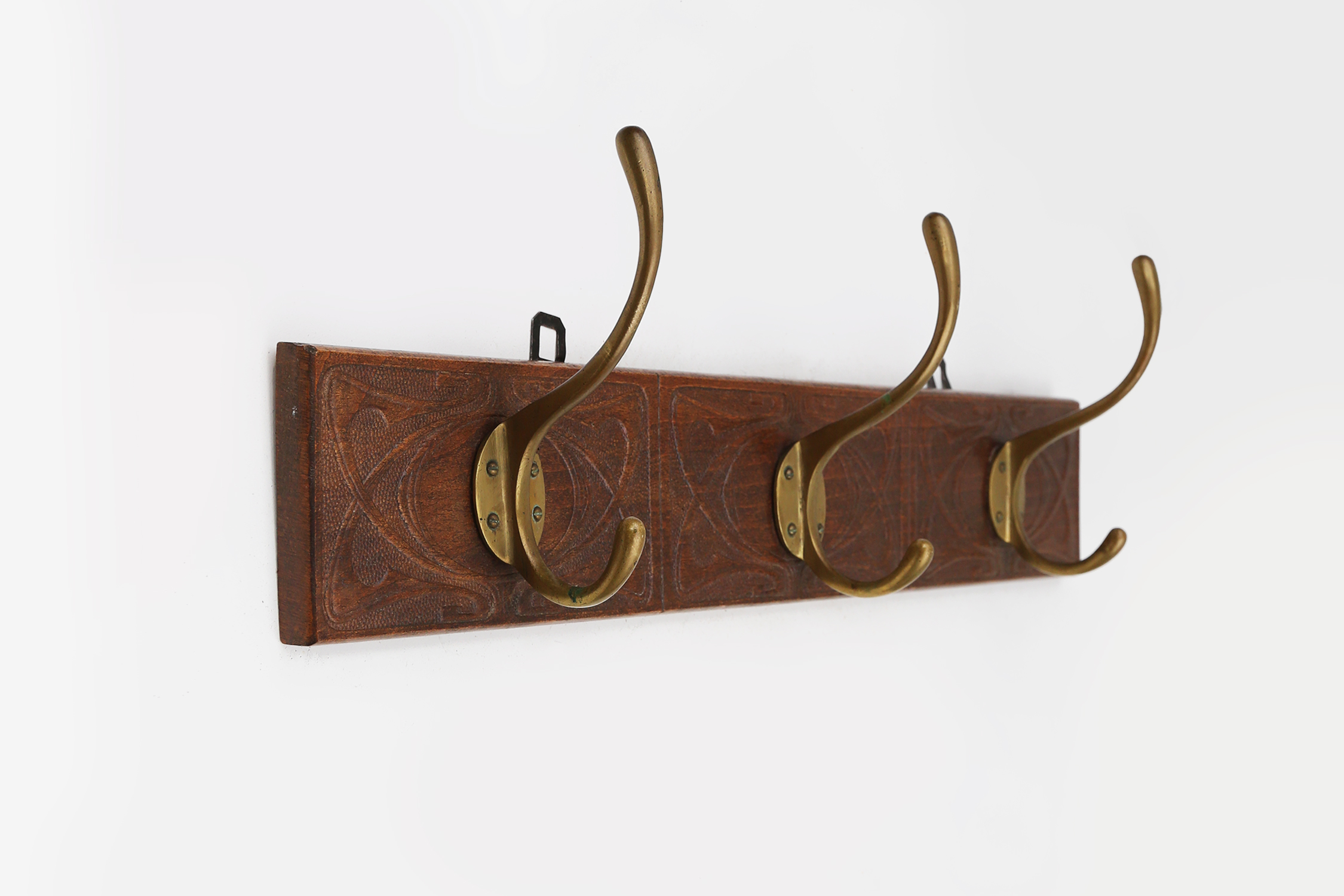 Art Nouveau wall coat rack in carved wood with brass, France ca. 1910thumbnail